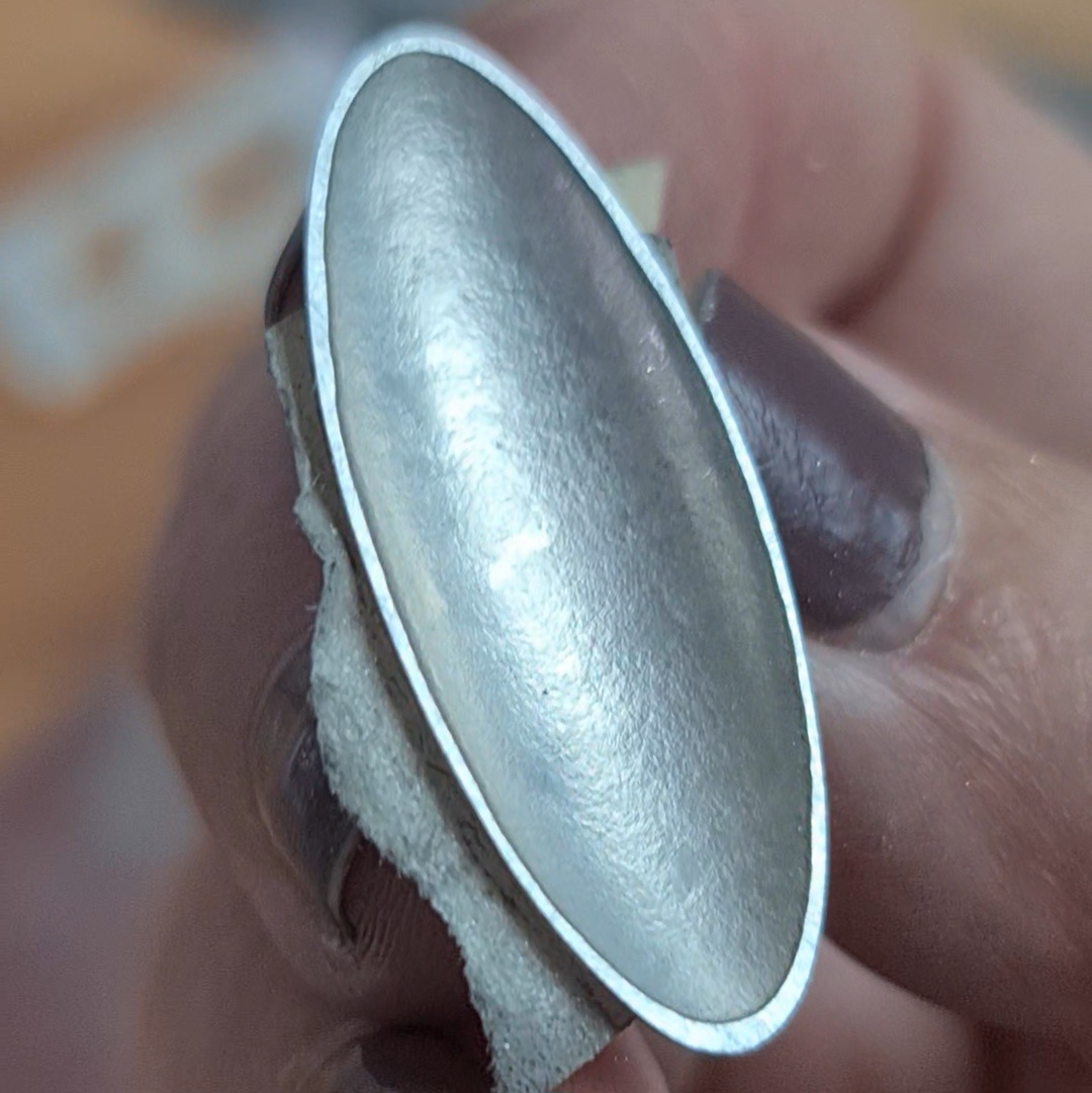 image shows the finished sanded oval with a neat flattened rim